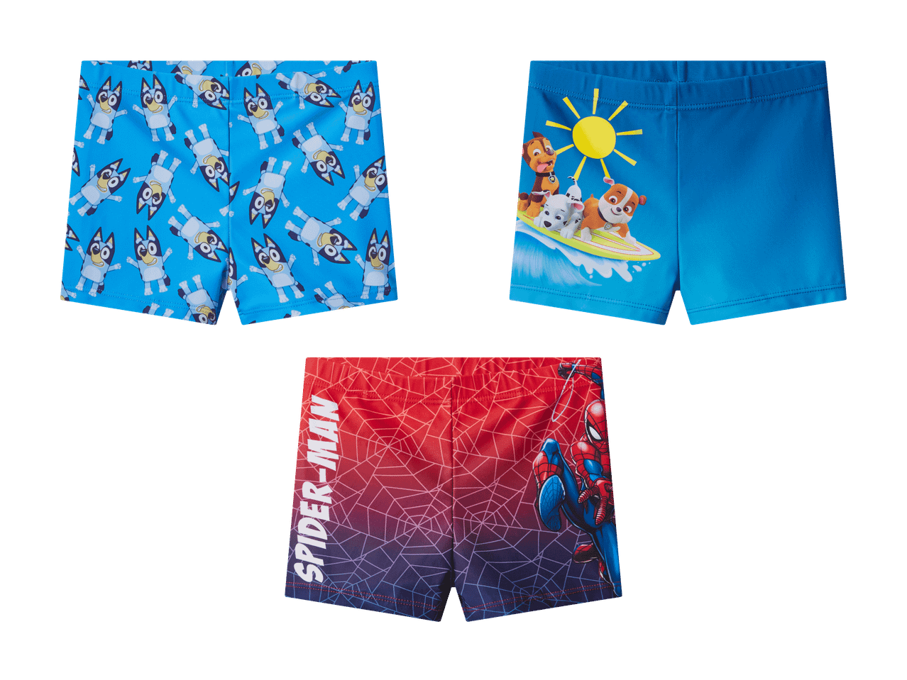 Drei Badeshorts für Jungen: blau mit Cartoon-Hunden, blau mit surfenden Welpen und rot/blau mit einem Superhelden.
