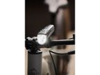 Crivit bike light attached to handlebars, illuminated.