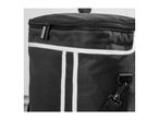 Close-up of a black cooler bag with a zipper and white reflective stripes.