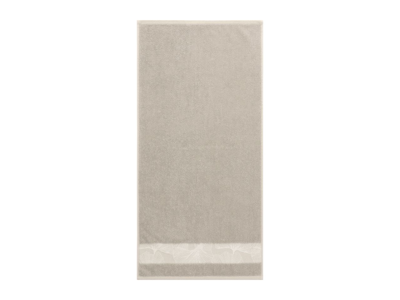Beige towel with a decorative patterned border at the bottom.