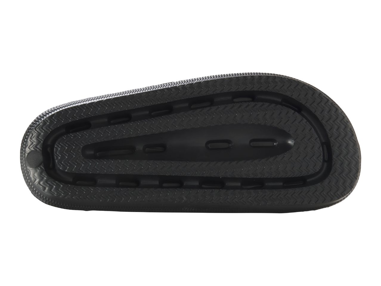 Bottom view of a black sandal with a textured sole.