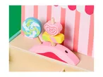 Wooden toy candy stand with a lollipop, heart-shaped candy, and striped awning.
