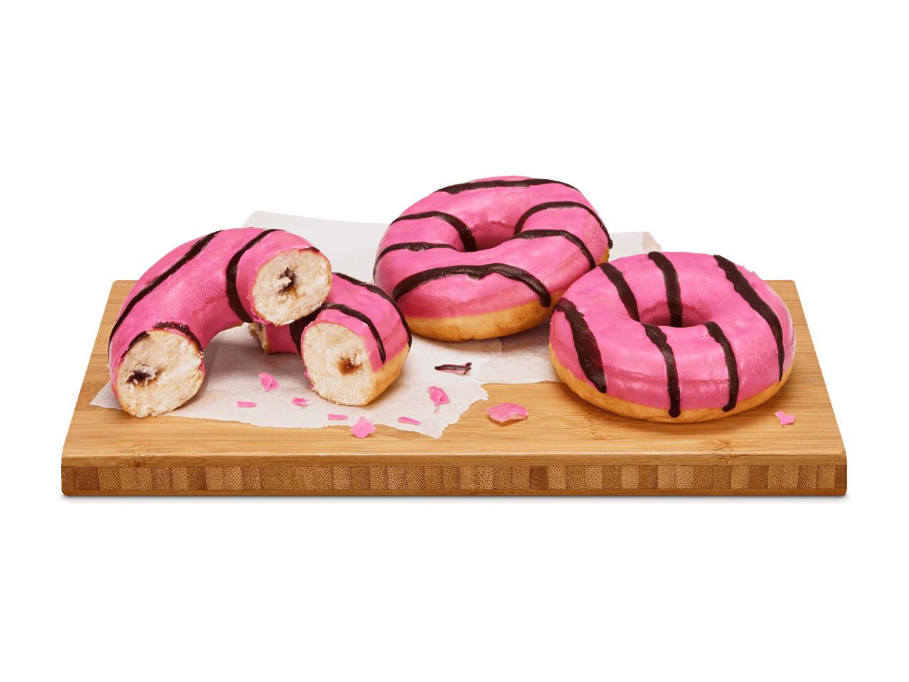 Rosa Donuts mit Schokoladenglasur auf einem Holzschneidebrett.