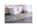 Tappetino da bagno beige chiaro davanti a una vasca da bagno bianca moderna.