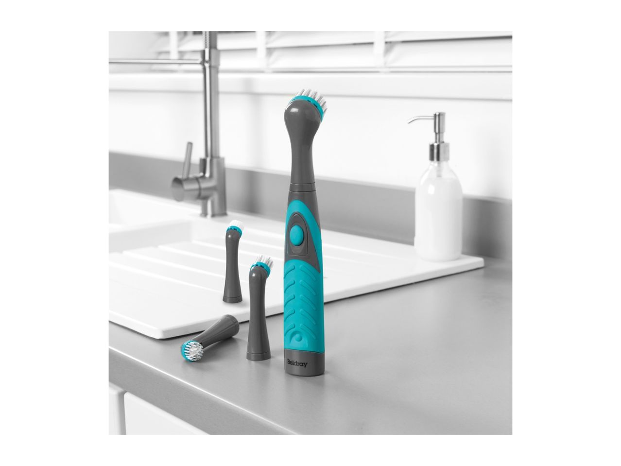Belray's cordless cleaning brush with interchangeable heads sits on a kitchen counter.
