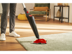 Cleaning carpet with a Vileda steam cleaner.