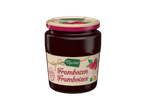 Confiture de framboises Maribel dans un pot en verre avec une étiquette rustique.