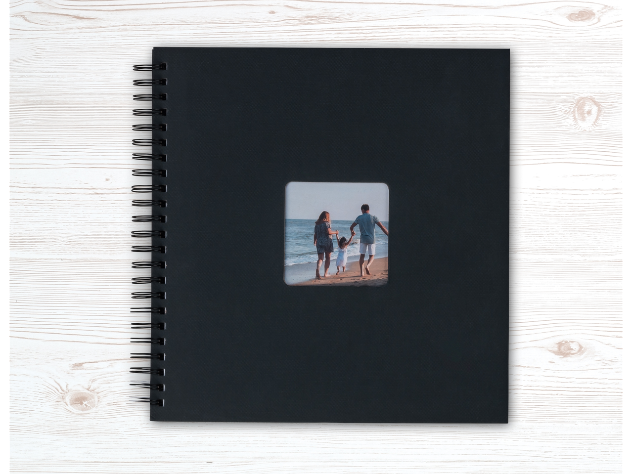Álbum de fotos Crelando preto com uma fotografia de família na capa