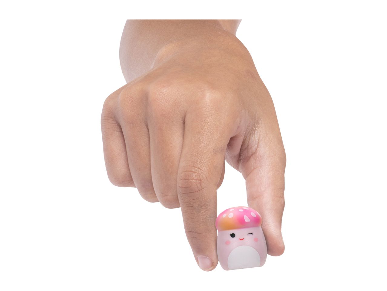 A hand holding a small, pink mushroom-shaped toy with a winking face.