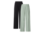 Dvoje ženskih širokih hlača, jedne crne i jedne svijetlozelene.