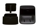 Black air fryer with removable basket and drawer, shown disassembled.