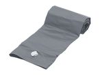 Grey inflatable sleeping pad, partially rolled up, with a white valve visible