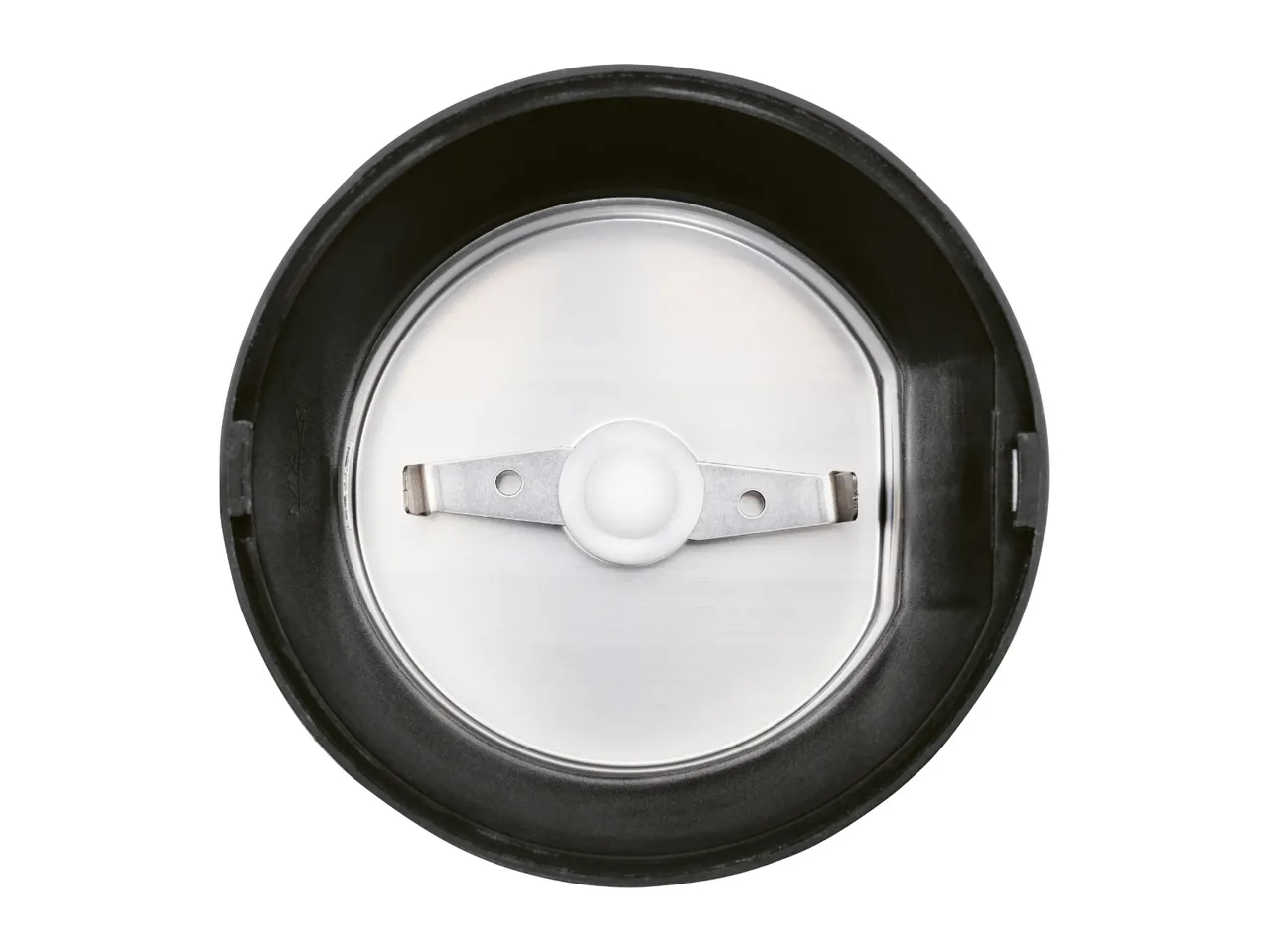 Top-down view of a coffee grinder's interior with a two-pronged blade.