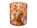 Halloween-themed candle in an orange glass holder with ghosts, bats, spiderwebs, and brooms.