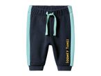 Looney Tunes baby sweatpants in navy with light blue side stripes and yellow text