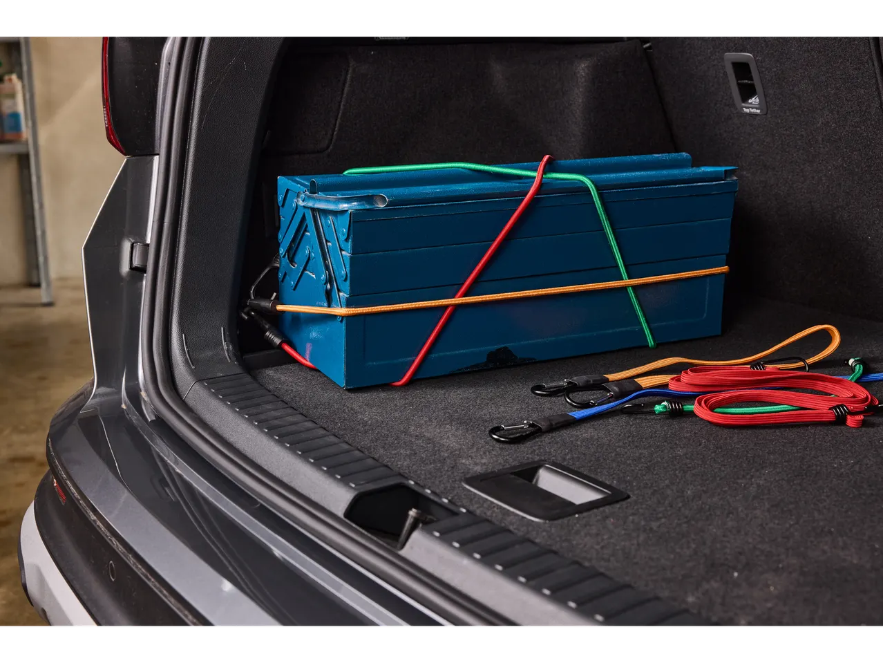 ULTIMATE SPEED elastic rope set and toolbox in car trunk.