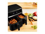 Dual basket air fryer with salmon and vegetables, surrounded by fresh ingredients.