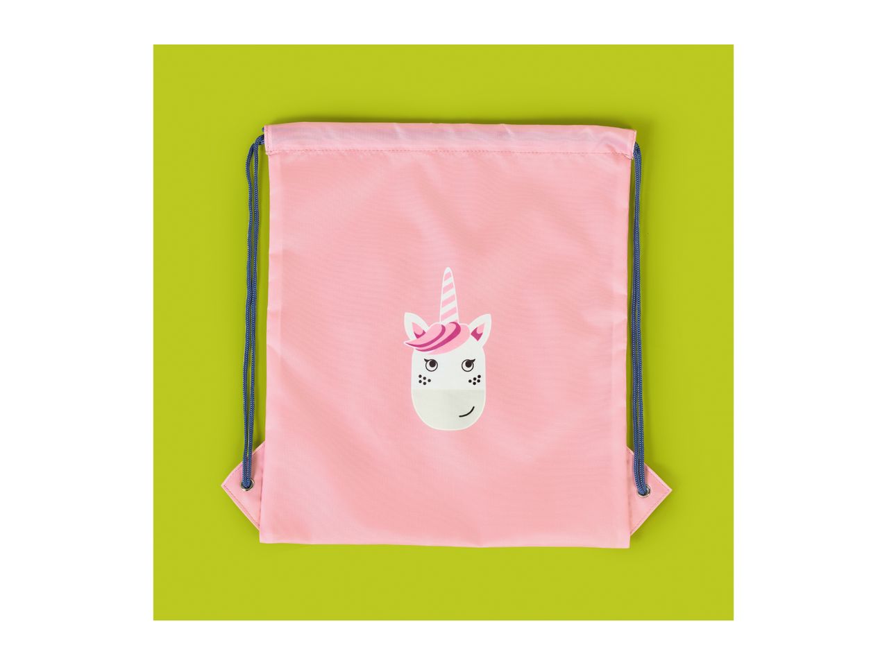 Pink drawstring bag with a unicorn face design on a green background.
