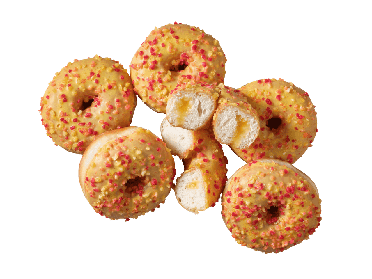 Donuts ar dzeltenu glazūru un krāsainām drumstalām, viens pārgriezts uz pusēm ar pildījumu.