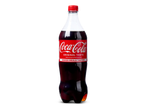 Een fles cola met de tekst 'ORIGINAL TASTE' en 'MAKES MEALS TASTIER'.