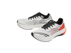 CRIVIT Men's Running Shoes: Two white and black athletic shoes with orange accents.