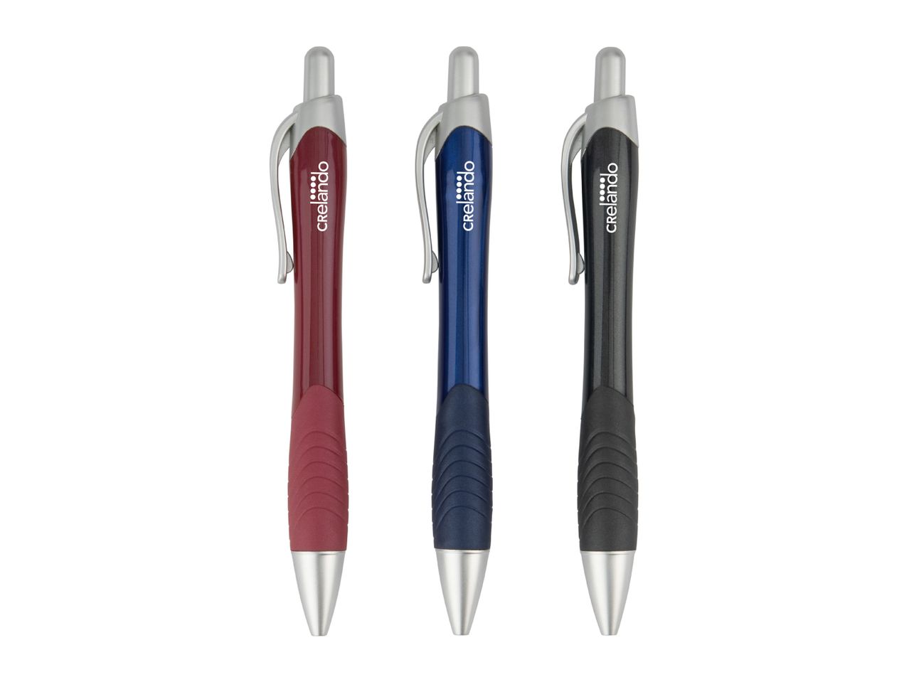 Three ballpoint pens in red, blue, and black with silver accents and textured grips.