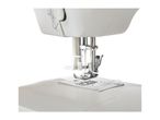 Close-up of a white sewing machine with blue thread.