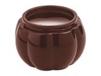 Brown pumpkin-shaped candle in a ceramic holder