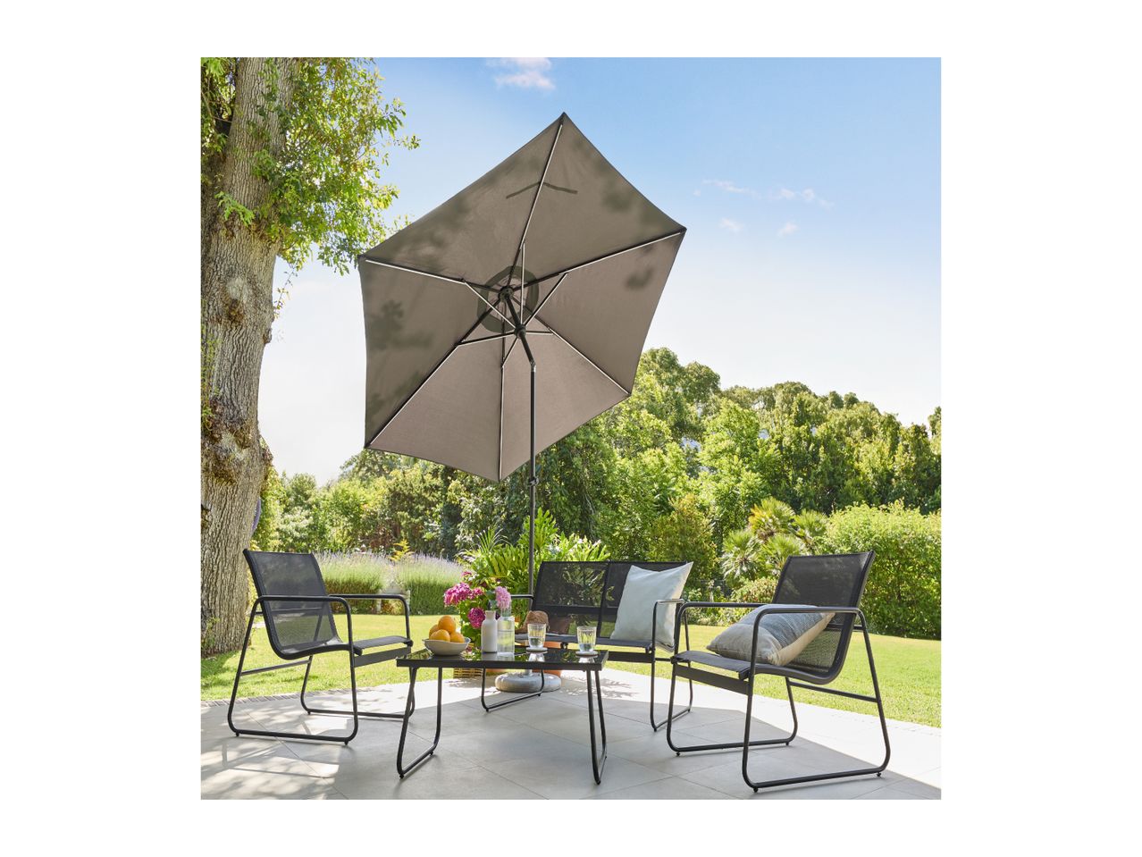 Outdoor patio set with a black metal table, four chairs, and a large grey umbrella.