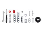 Assorted construction toy parts including screws, plates, and tools.