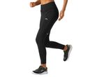 A woman runs in black Kalenji running leggings and shoes.