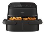 Black air fryer with fries and chicken wings in separate compartments, digital display.