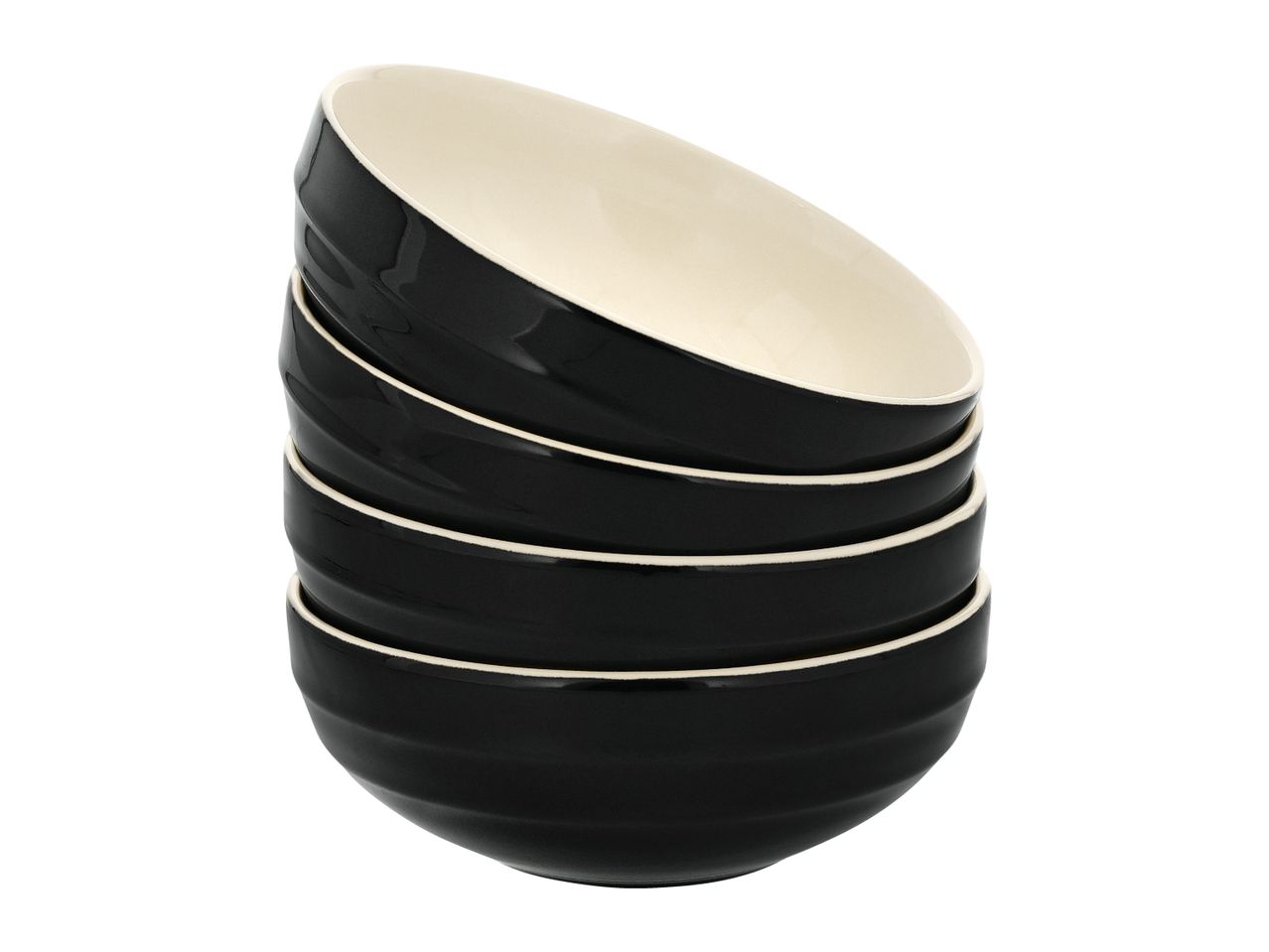 Stack of five black ceramic bowls with cream-colored interiors.