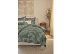 Livarno Home Sateen Duvet Cover Set with green leaf pattern on a bed in a bright room.