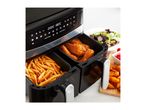 Tower air fryer with fries and chicken, alongside a salad and potato wedges.