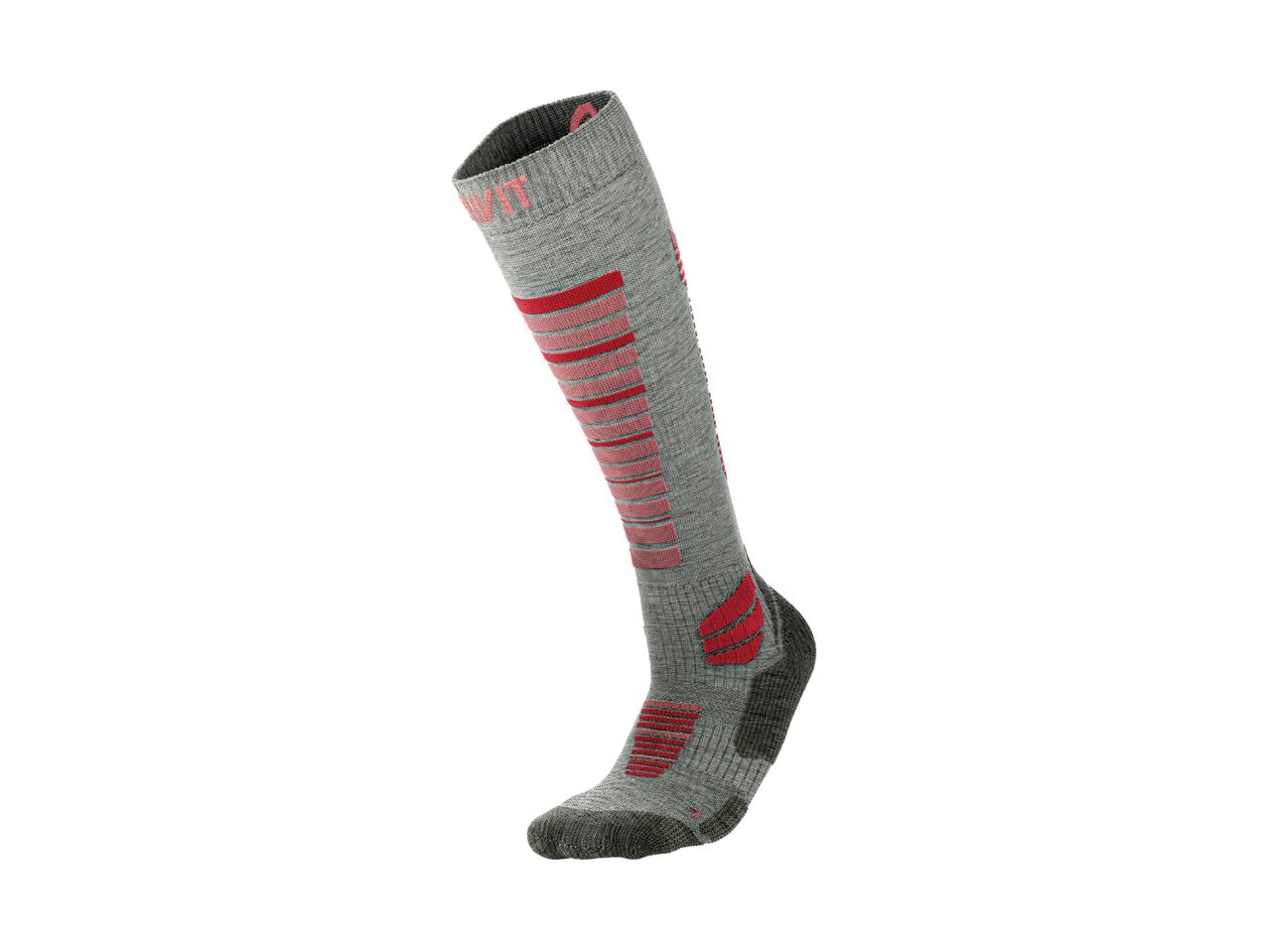 Grey and red ski sock with textured patterns and reinforced areas