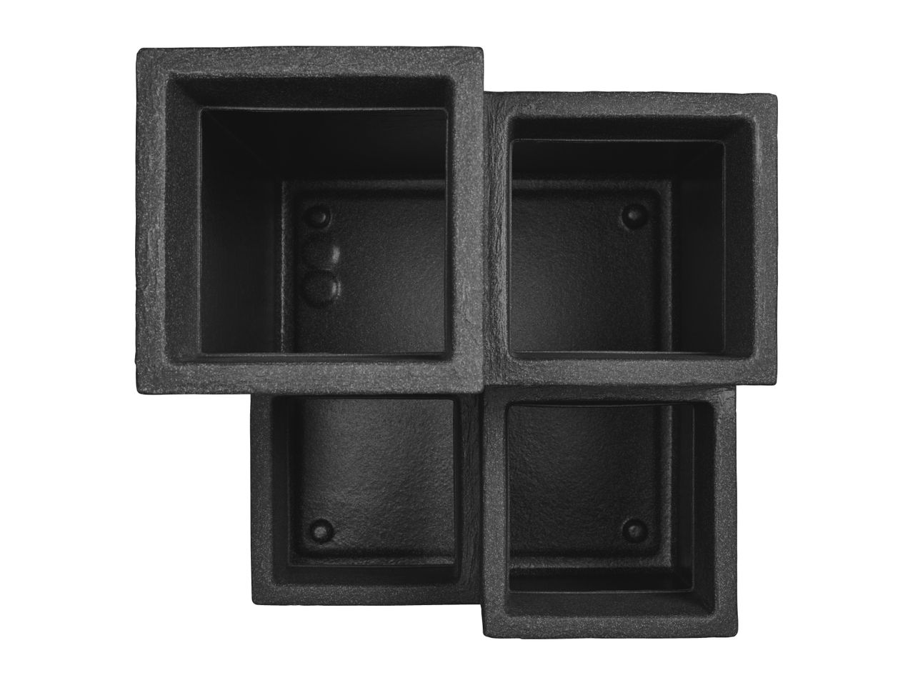 Top-down view of four interconnected black square planters with textured surfaces.