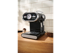 SILVERCREST® Espresso Machine with a gauge and coffee beans on a wooden counter.