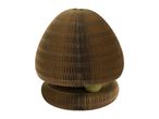 Cardboard cat scratcher with a green ball, shaped like a mushroom.