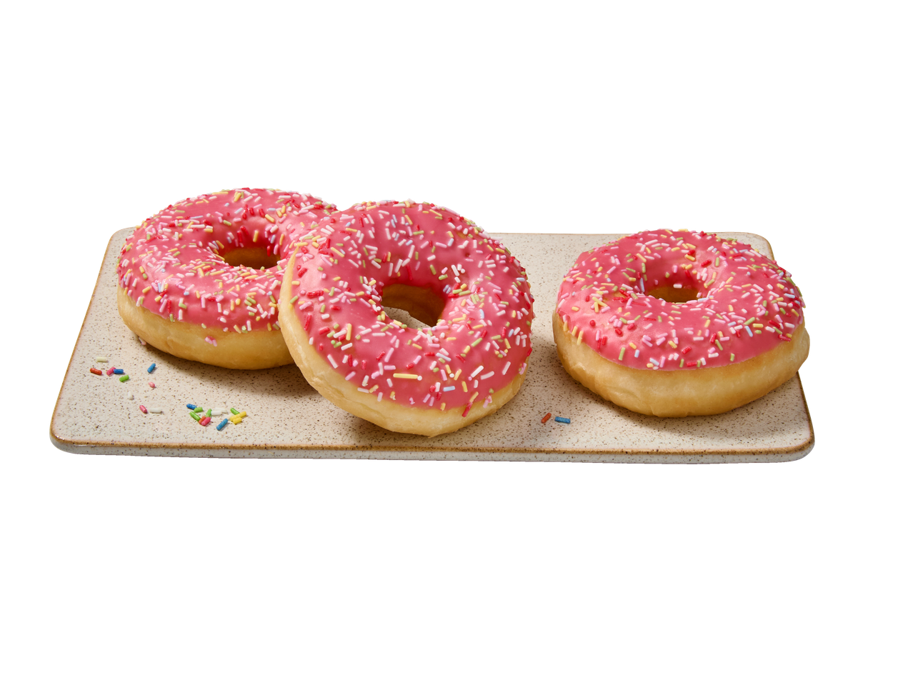 Kolm roosa glasuuri ja värviliste puistekommidega sõõrikut ristkülikukujulisel alusel.