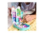Child playing with a Gabby's Dollhouse Purrfect Playset, featuring miniature figures and rooms.