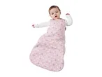 Baby in a pink star-patterned sleeping bag with a white long-sleeved top.