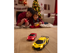 Father and child playing with Lupilu Remote Control Toy Cars on Christmas.
