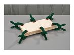 Six spring clamps holding together two pieces of wood on a grey surface.
