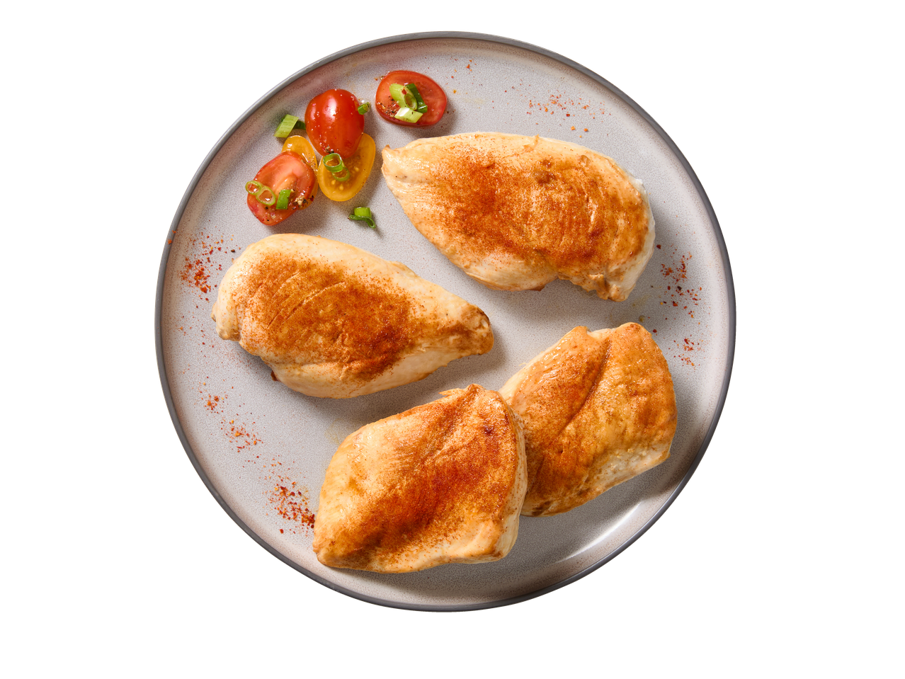 Quatro filetes de frango temperados com tomate e cebolinho num prato.