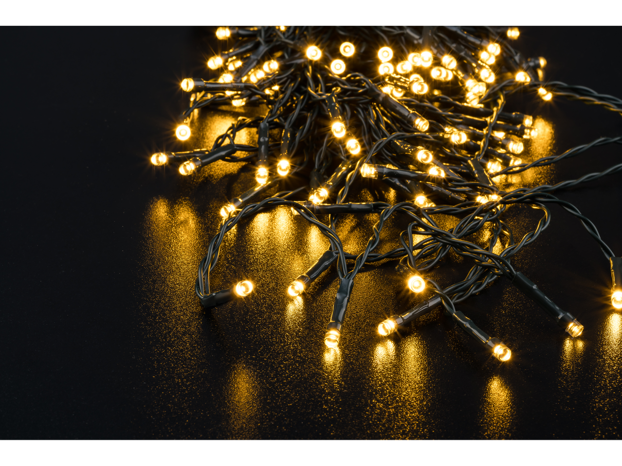 LIVARNO home 50 LED Fairy Lights, warm white glow on a dark surface