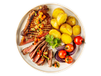 Grilled steak with roasted potatoes, tomatoes, and red onions on a white plate.