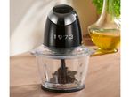 A black and chrome food chopper with a clear bowl on a wooden surface.