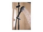 Black shower head spraying water in a modern bathroom.