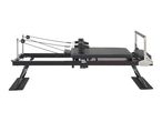 Black pilates reformer with adjustable ropes and foot bar